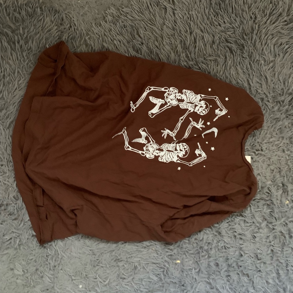 Brown t with dancing skelly